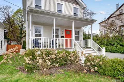 front view of a house with a yard