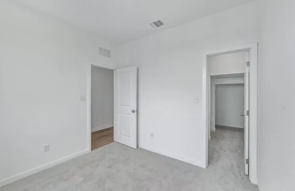a bathroom with a bathtub shower sink vanity and toilet