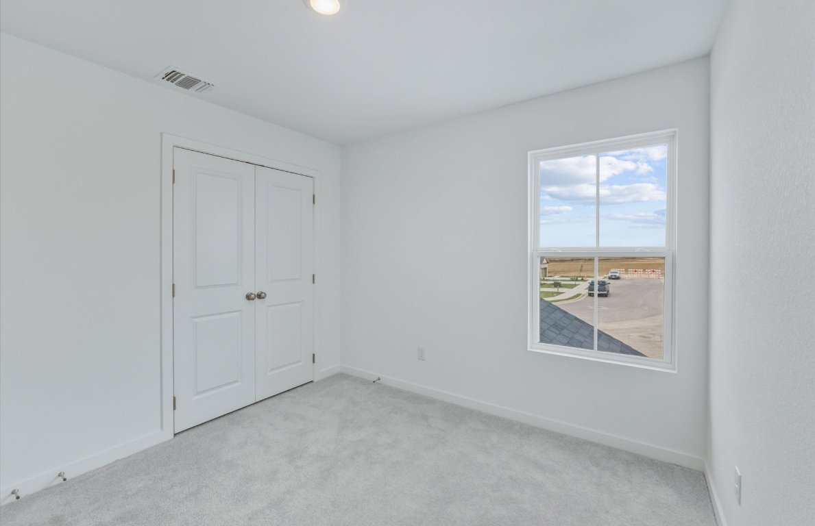 337 Sullivan Way Elgin, TX 78621 - Photo 18 of 25 an empty room with windows