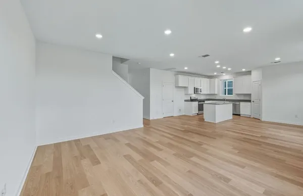 a view of kitchen with wooden floor