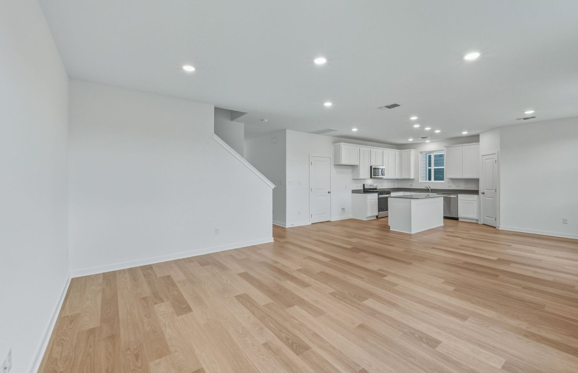 337 Sullivan Way Elgin, TX 78621 - Photo 4 of 25 a view of kitchen with wooden floor