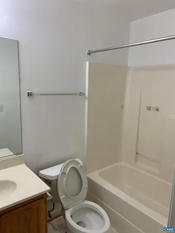a bathroom with a sink a toilet and a bathtub