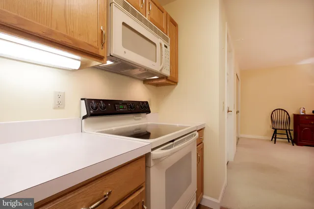 a kitchen with a stove and a microwave