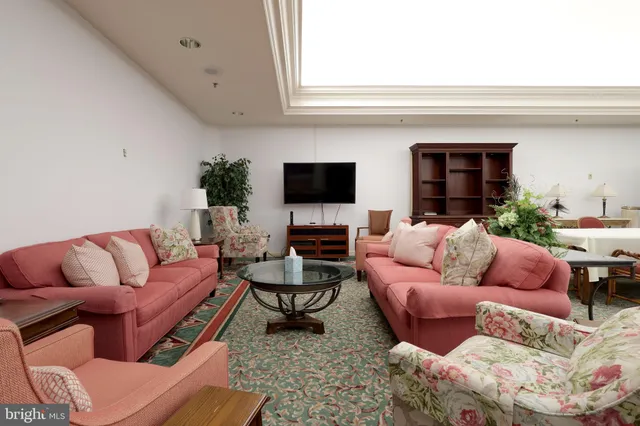 a large room with lots of counter space and windows