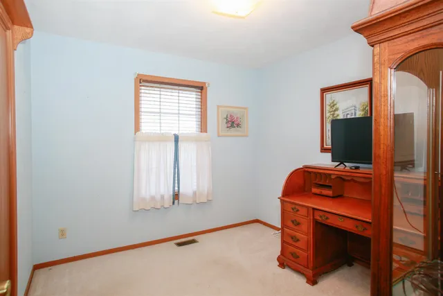 a room with chair and window