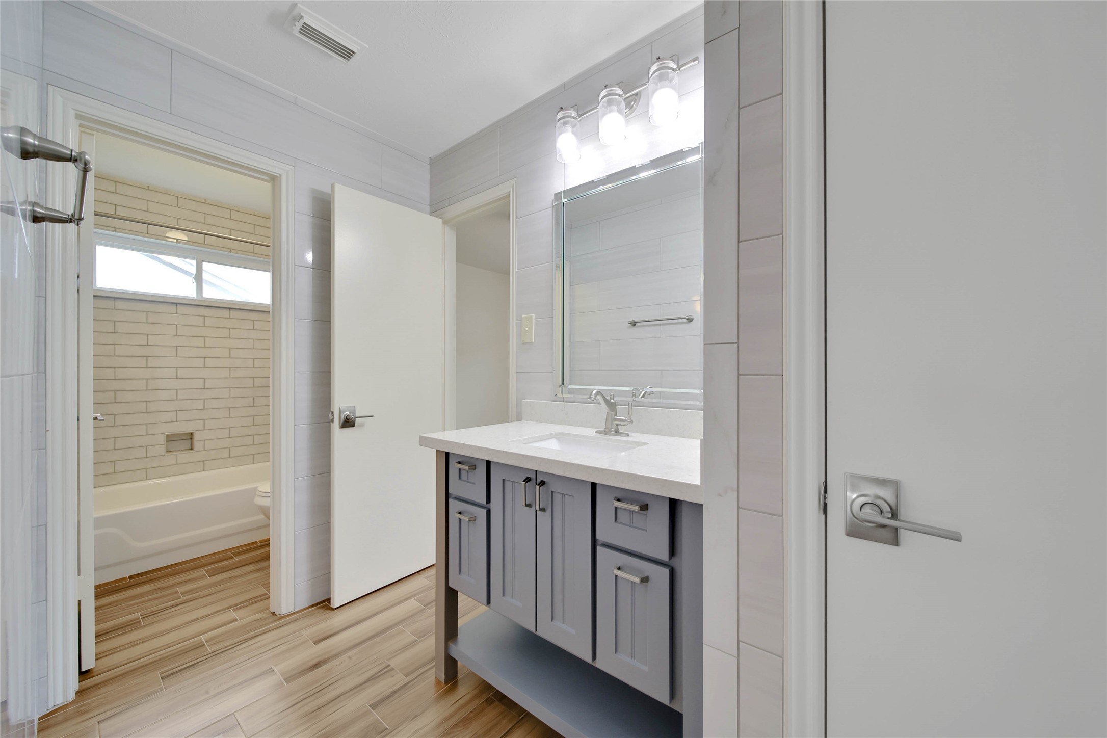 5010 Cupids Bower Court Spring, TX 77388 - Photo 28 of 40 a bathroom with a sink a mirror and a shower