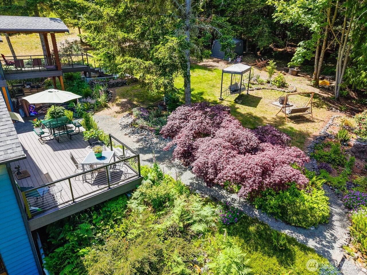 492 Walkabout Way Port Angeles, WA 98363 - Photo 3 of 40 a view of a garden with a patio