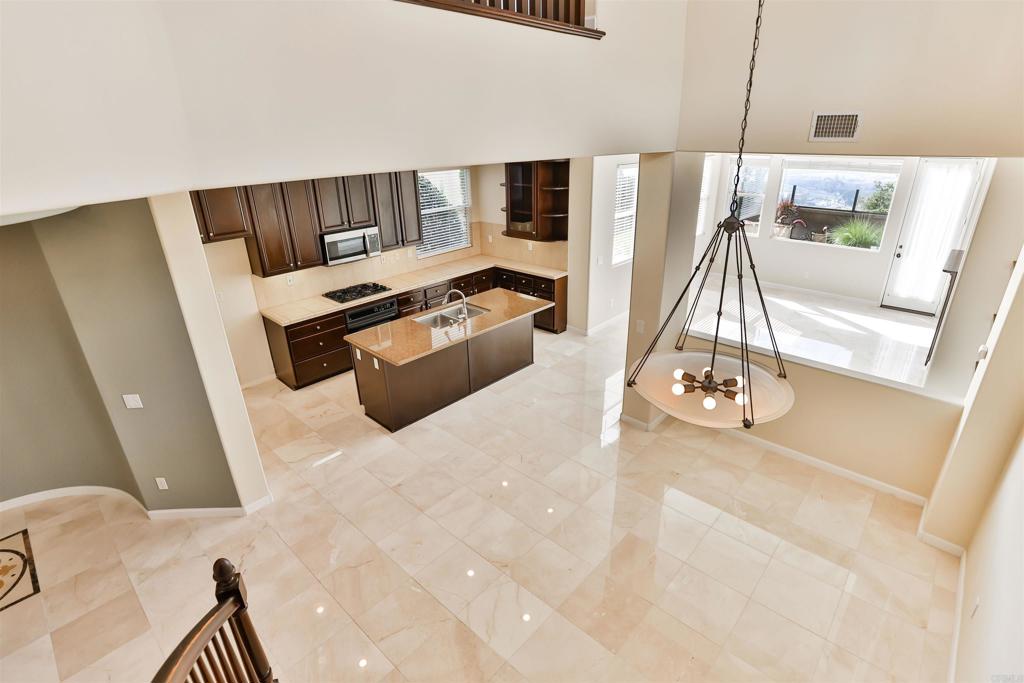 11477 Miro Circle San Diego, CA 92131 - Photo 13 of 36 a living room with furniture and a flat screen tv