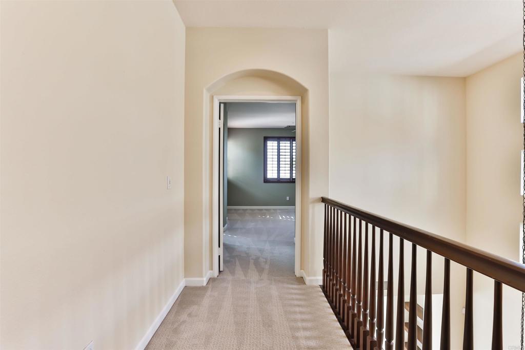 11477 Miro Circle San Diego, CA 92131 - Photo 16 of 36 a view of a hallway view with a wooden floor