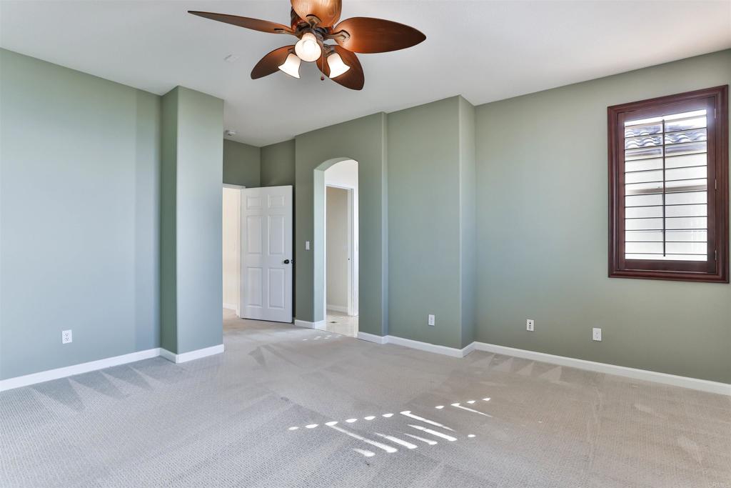 11477 Miro Circle San Diego, CA 92131 - Photo 19 of 36 an empty room with windows and fan