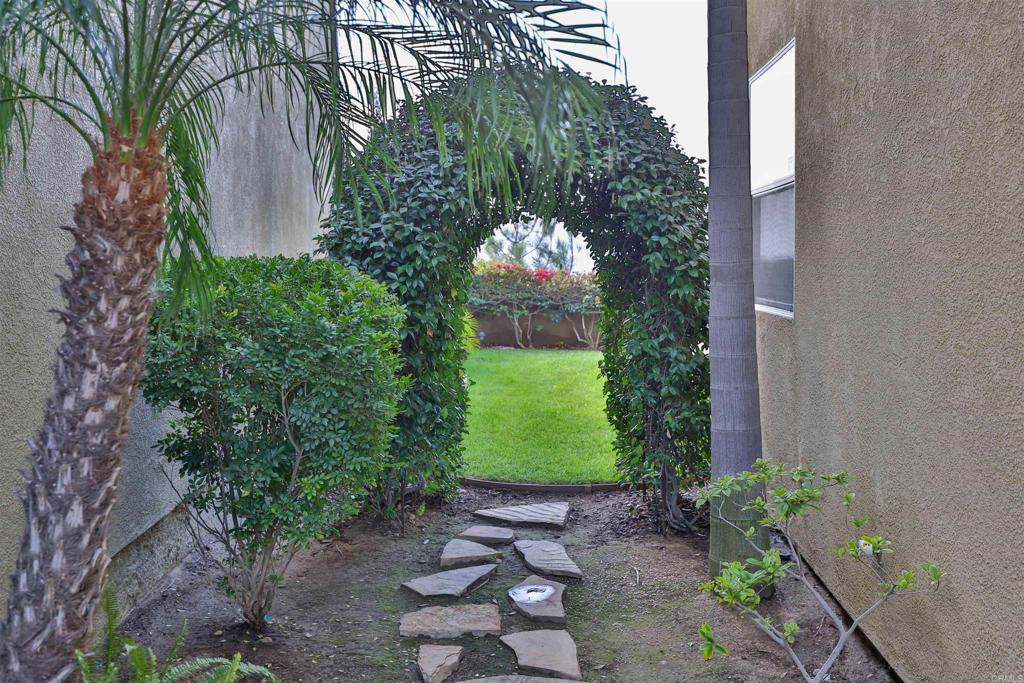 11477 Miro Circle San Diego, CA 92131 - Photo 2 of 36 a view of a pathway in a garden
