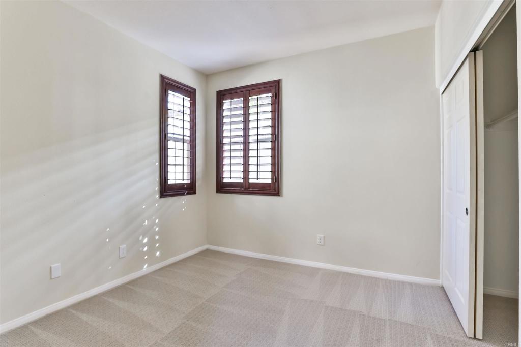 11477 Miro Circle San Diego, CA 92131 - Photo 22 of 36 an empty room with windows