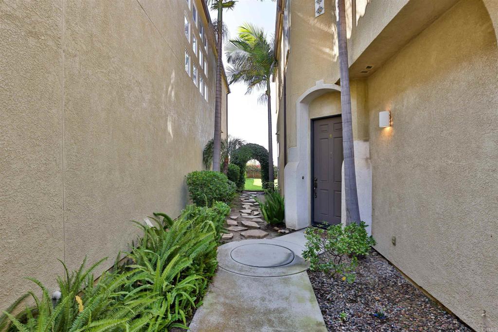 11477 Miro Circle San Diego, CA 92131 - Photo 29 of 36 a front view of a house with a yard