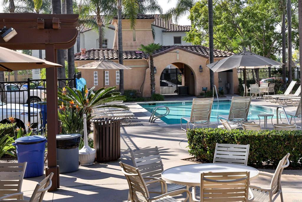 11477 Miro Circle San Diego, CA 92131 - Photo 34 of 36 a view of a patio with table and chairs potted plants