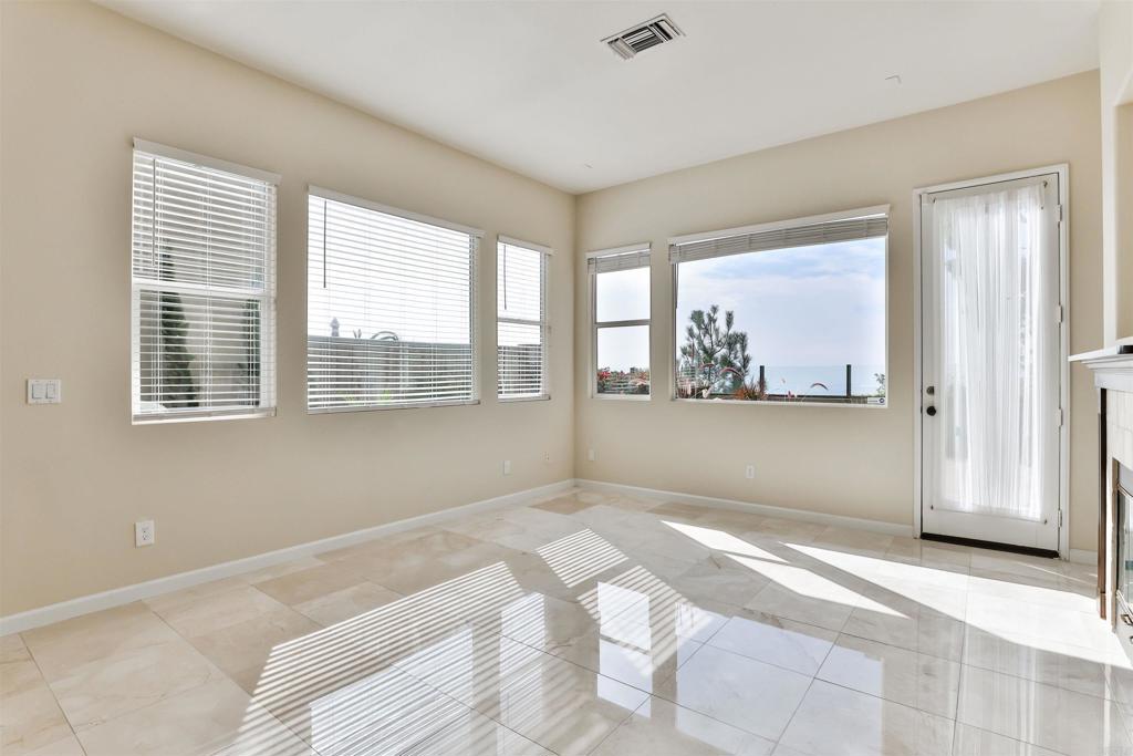 11477 Miro Circle San Diego, CA 92131 - Photo 10 of 36 a view of wooden floor and windows in a room