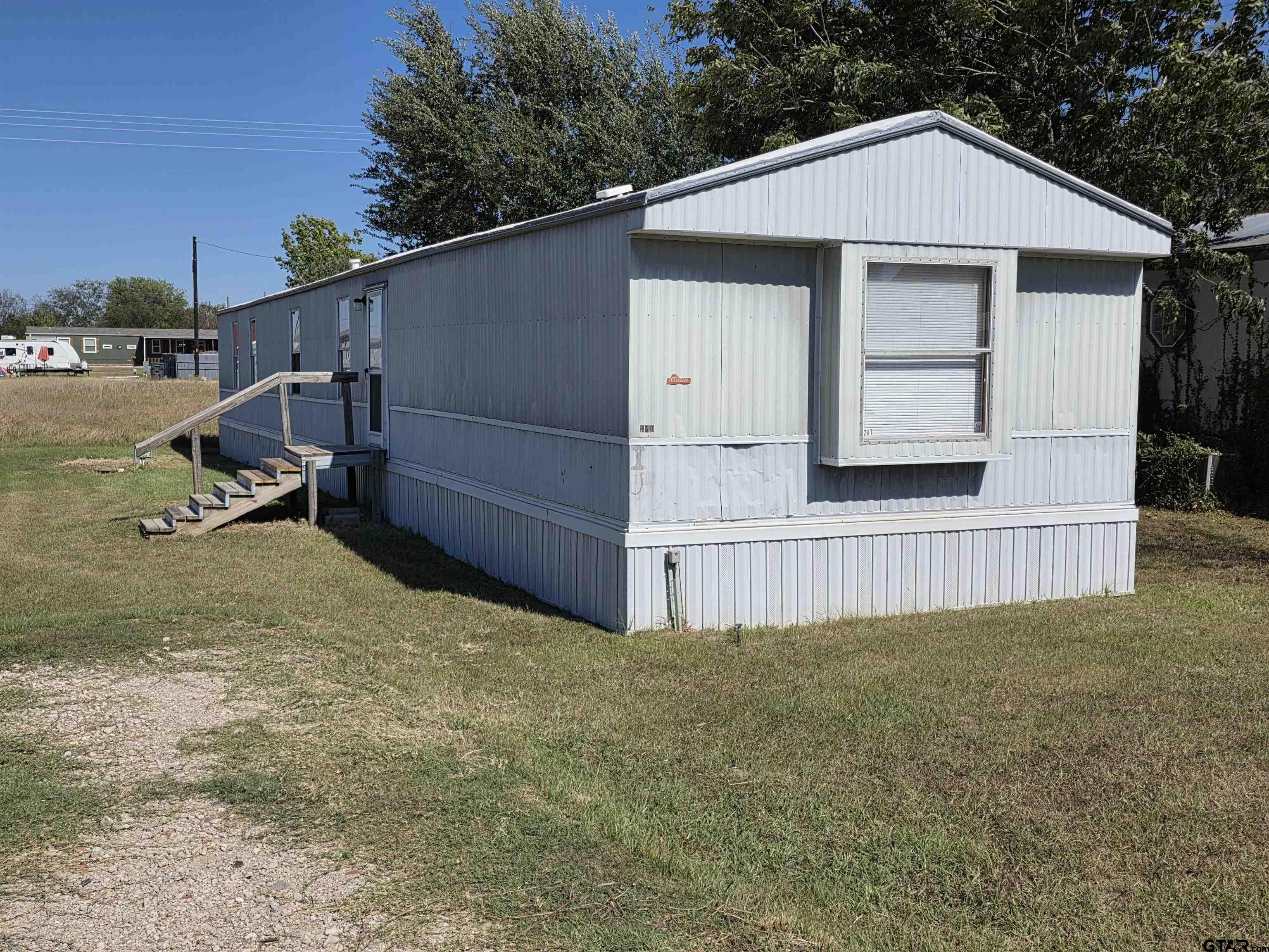 281 Sioux Quitman, TX 75783 - Photo 2 of 33 a view of backyard with cabin