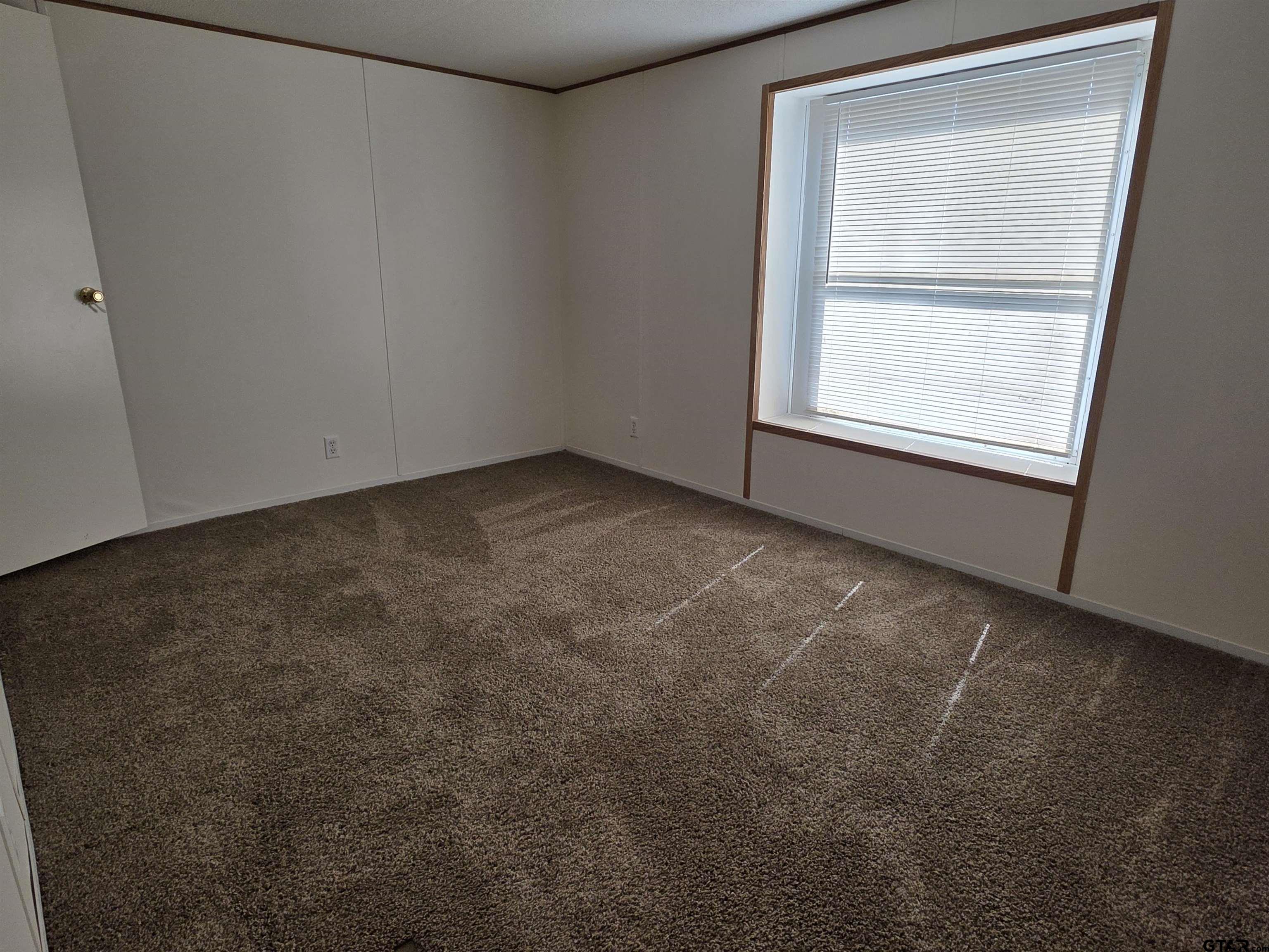 281 Sioux Quitman, TX 75783 - Photo 22 of 33 an empty room with a window
