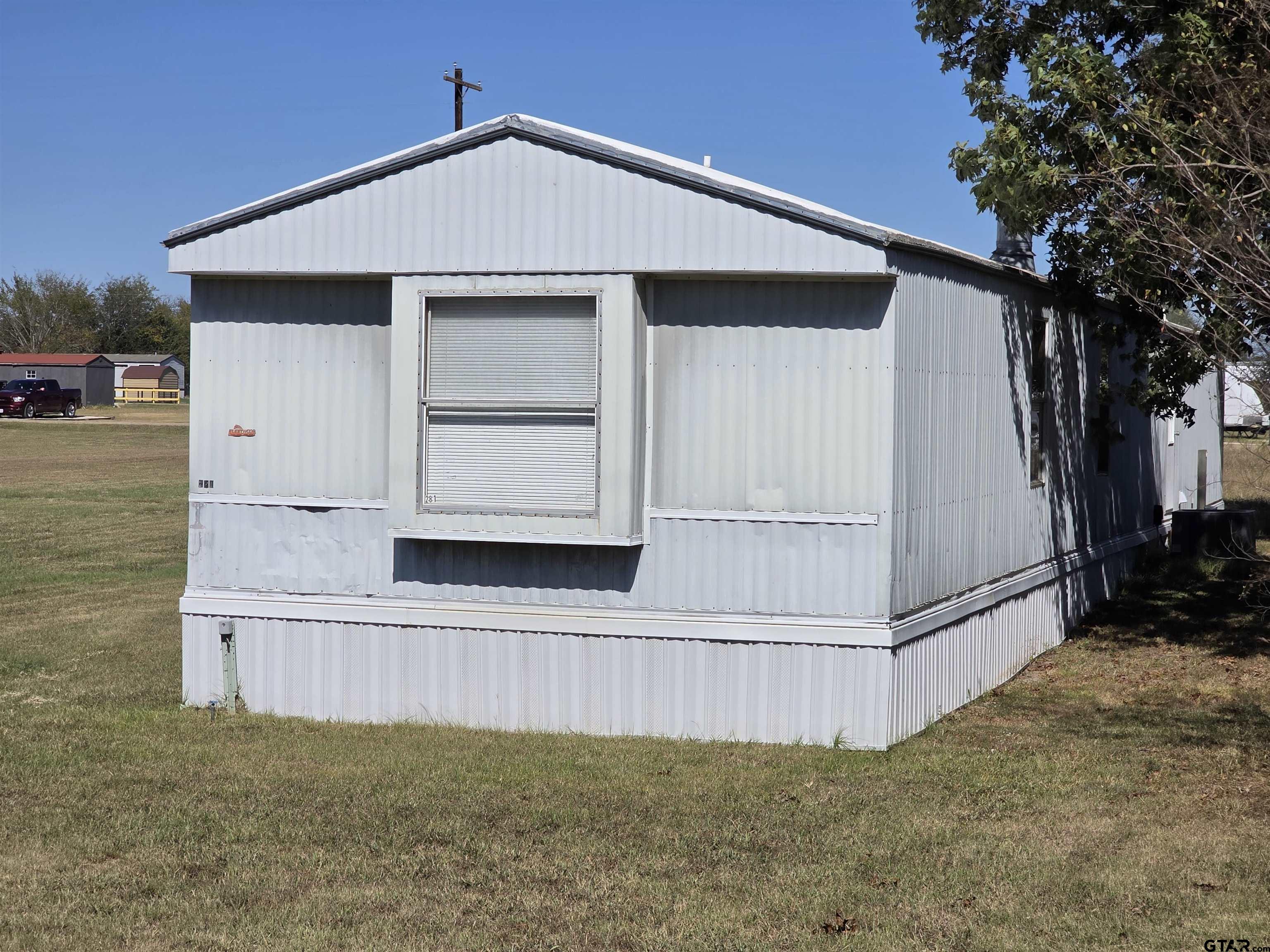 281 Sioux Quitman, TX 75783 - Photo 3 of 33 a view of backyard with cabin