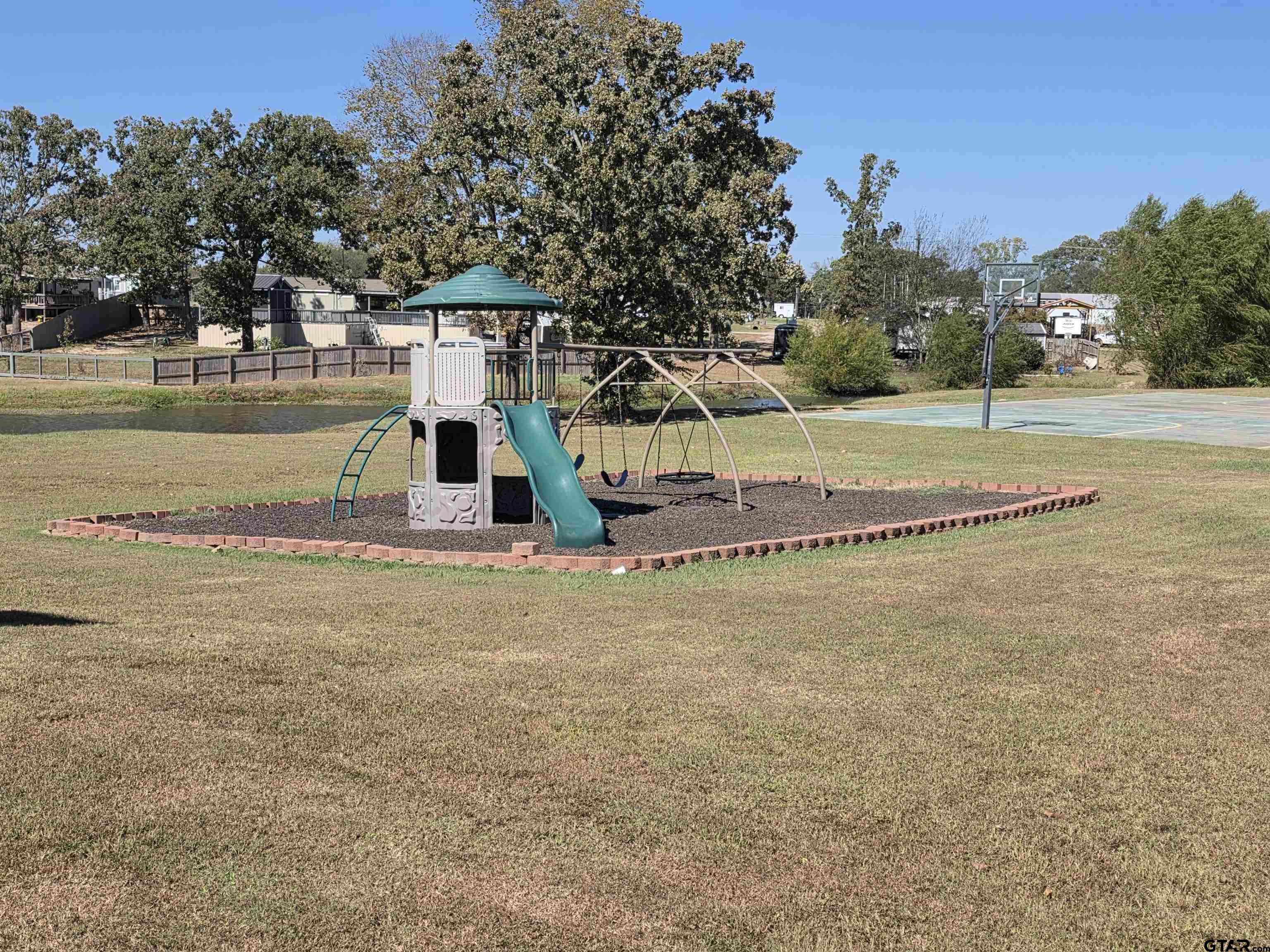 281 Sioux Quitman, TX 75783 - Photo 31 of 33 a small garden with trees in the background
