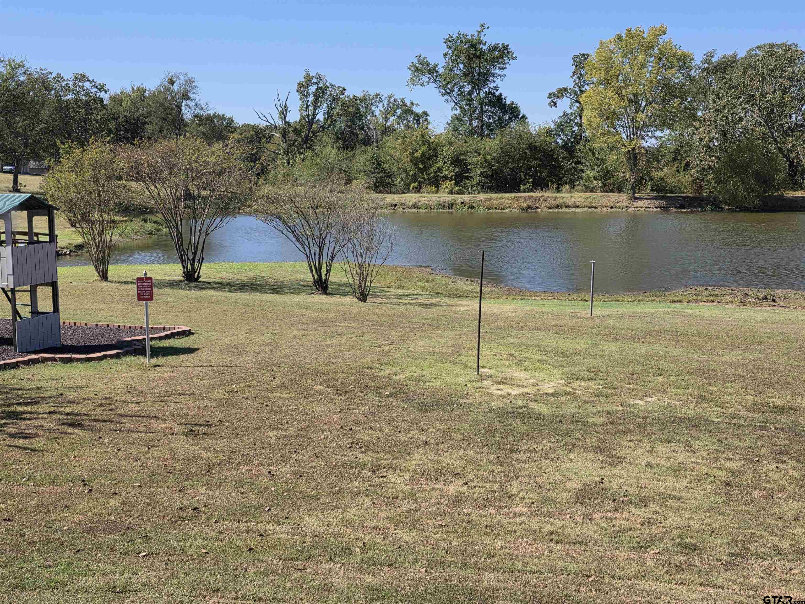 281 Sioux Quitman, TX 75783 - Photo 33 of 33 a view of a lake with a yard