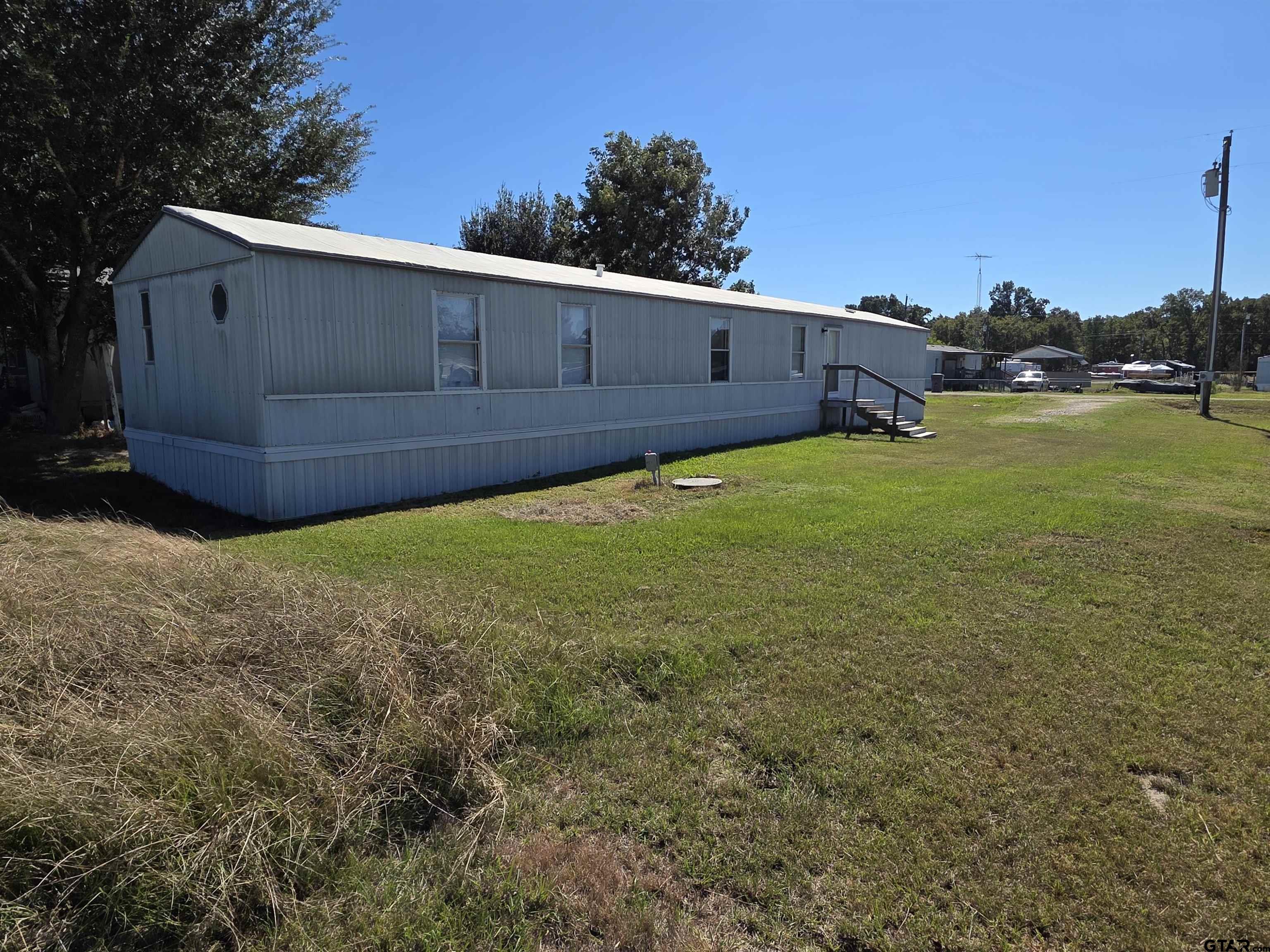 281 Sioux Quitman, TX 75783 - Photo 5 of 33 a backyard of a house