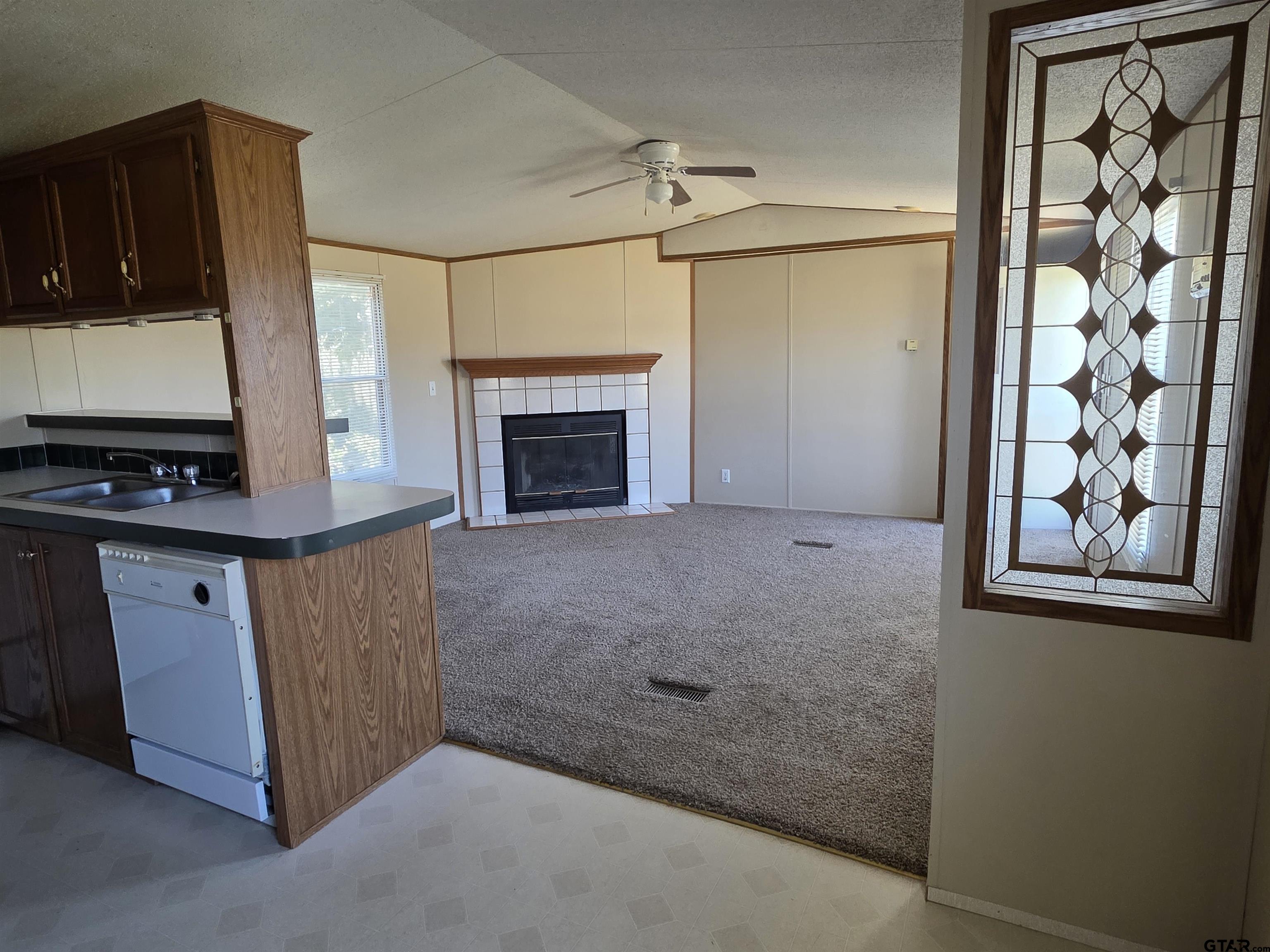 281 Sioux Quitman, TX 75783 - Photo 7 of 33 a view of an empty room with window and cabinet