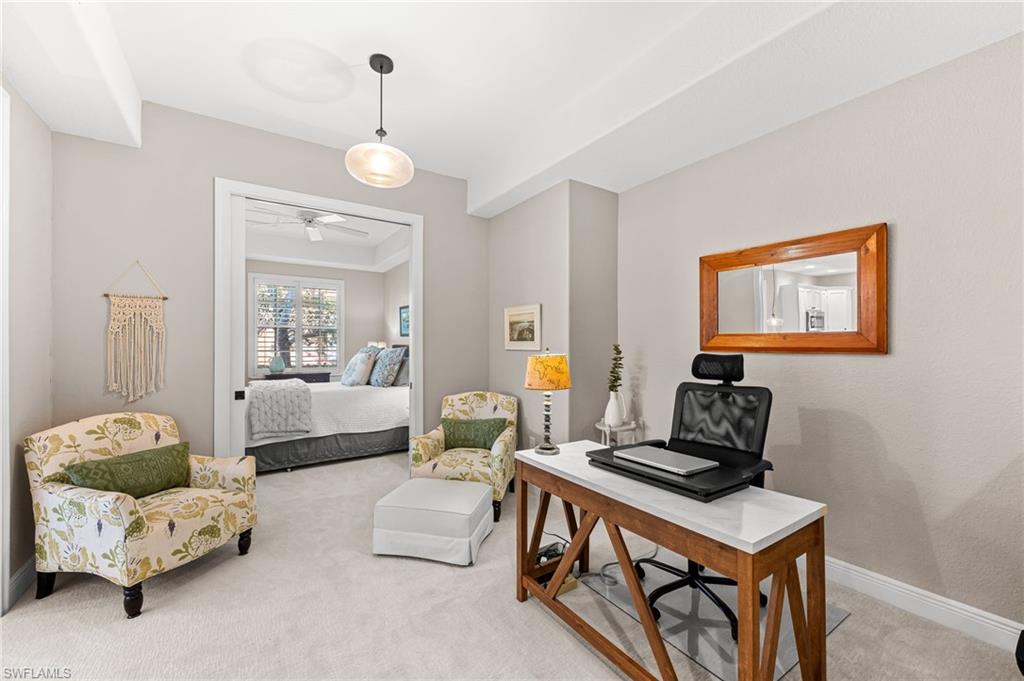 6418 Legacy Circle, Unit 802 Naples, FL 34113 - Photo 10 of 47 a living room with furniture and wooden floor