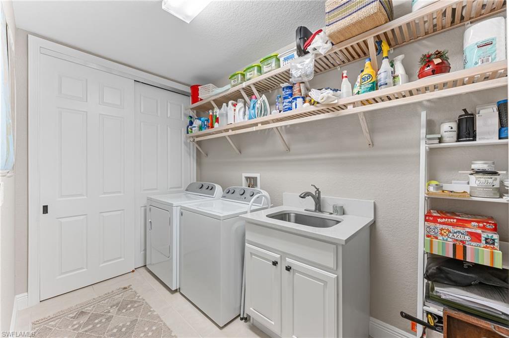 6418 Legacy Circle, Unit 802 Naples, FL 34113 - Photo 21 of 47 a room with storage and utility