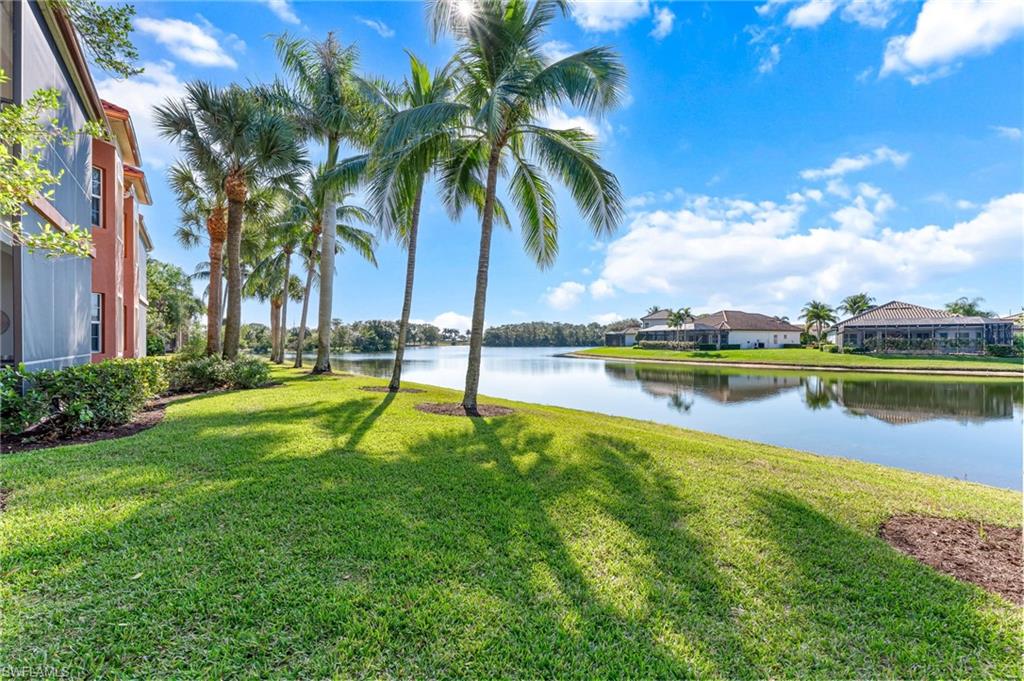 6418 Legacy Circle, Unit 802 Naples, FL 34113 - Photo 26 of 47 a view of a lake with a big yard