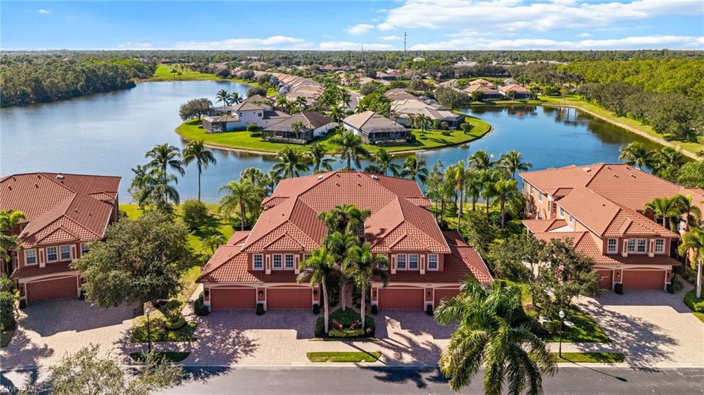 6418 Legacy Circle, Unit 802 Naples, FL 34113 - Photo 29 of 47 an aerial view of residential houses with outdoor space and swimming pool