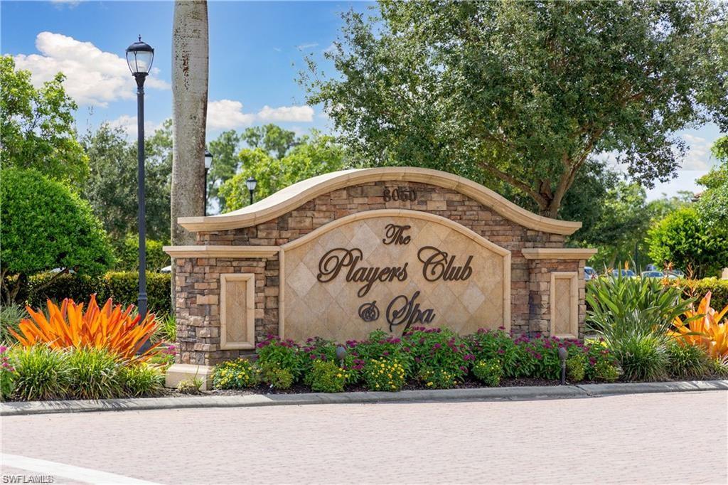 6418 Legacy Circle, Unit 802 Naples, FL 34113 - Photo 37 of 47 a wooden sign on the side of a road