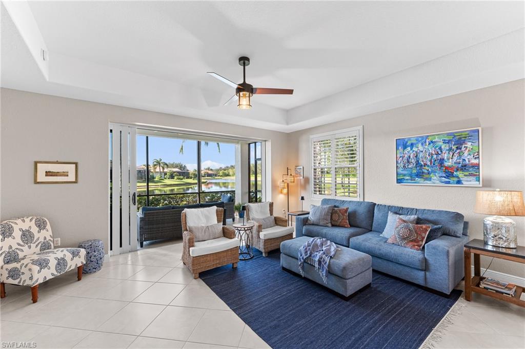 6418 Legacy Circle, Unit 802 Naples, FL 34113 - Photo 3 of 47 a living room with furniture and a large window