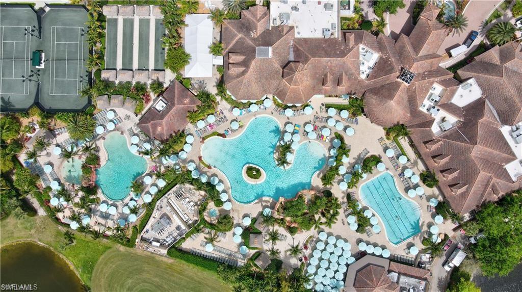 6418 Legacy Circle, Unit 802 Naples, FL 34113 - Photo 43 of 47 an aerial view of a house with a yard and garden