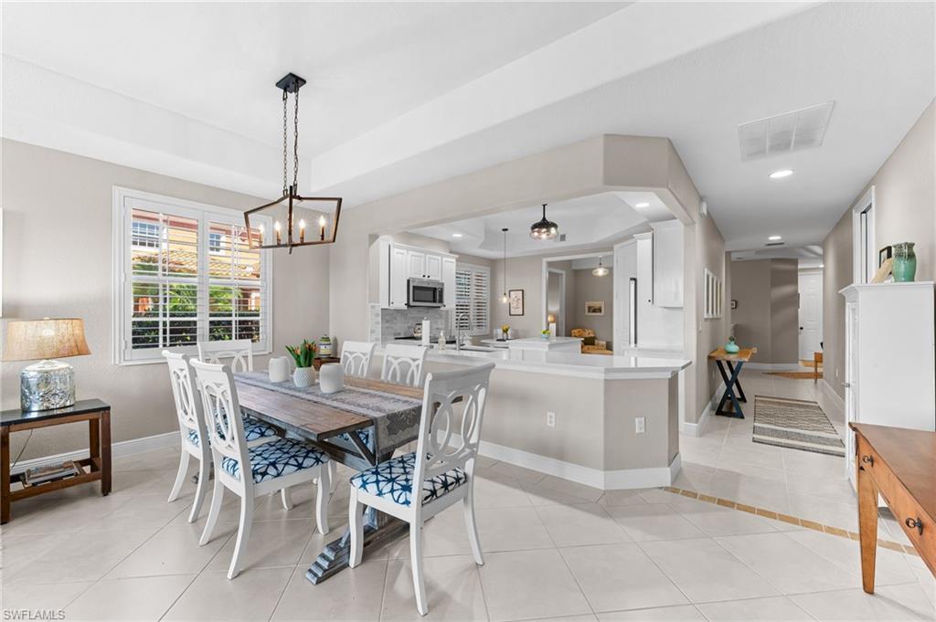 6418 Legacy Circle, Unit 802 Naples, FL 34113 - Photo 5 of 47 a view of a dining room and livingroom