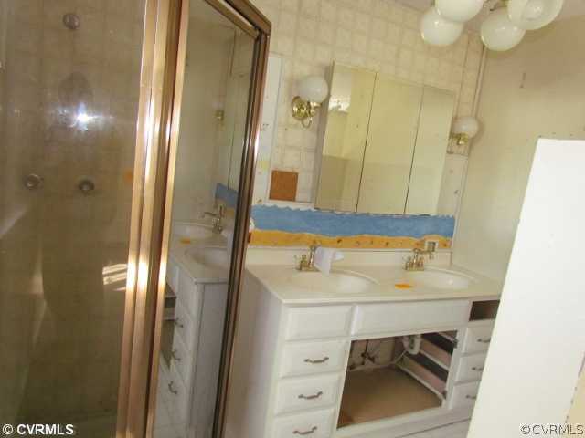 17030 Branders Bridge Road Colonial Heights, VA 23834 - Photo 9 of 12 a bathroom with a sink and a mirror