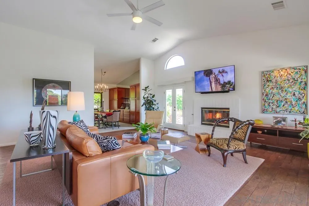 924 Ridge Heights Drive Fallbrook, CA 92028 - Photo 16 of 75 a living room with furniture a flat screen tv and a fireplace