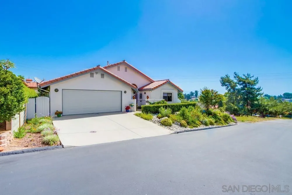 924 Ridge Heights Drive Fallbrook, CA 92028 - Photo 2 of 75 a front view of a house with a yard and garage