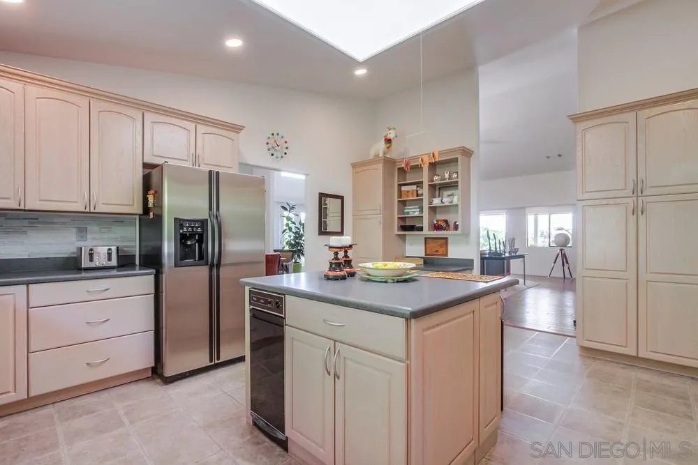 924 Ridge Heights Drive Fallbrook, CA 92028 - Photo 31 of 75 a kitchen with stainless steel appliances a sink stove and refrigerator