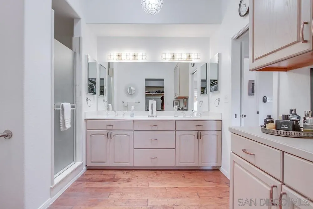 924 Ridge Heights Drive Fallbrook, CA 92028 - Photo 43 of 75 a spacious bathroom with a granite countertop double sink and a mirror