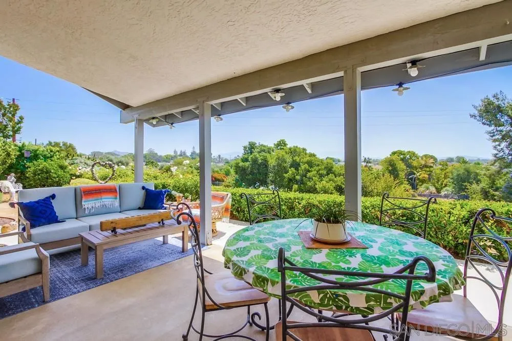 924 Ridge Heights Drive Fallbrook, CA 92028 - Photo 62 of 75 a patio with table and chairs with potted plants