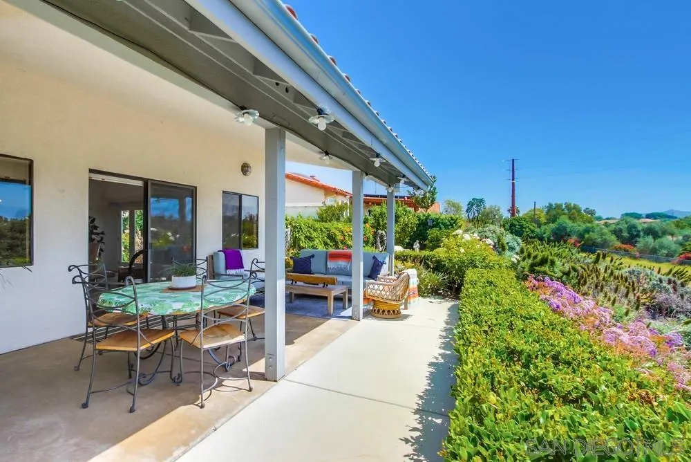 924 Ridge Heights Drive Fallbrook, CA 92028 - Photo 63 of 75 a view of a patio with table and chairs and potted plants