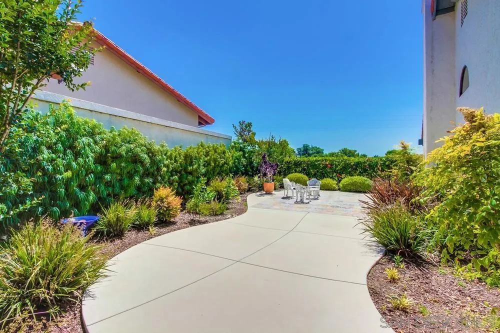924 Ridge Heights Drive Fallbrook, CA 92028 - Photo 72 of 75 a view of a backyard with potted plants and a large tree