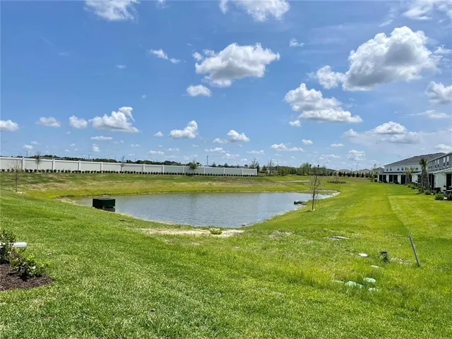 a view of a swimming pool with an ocean view