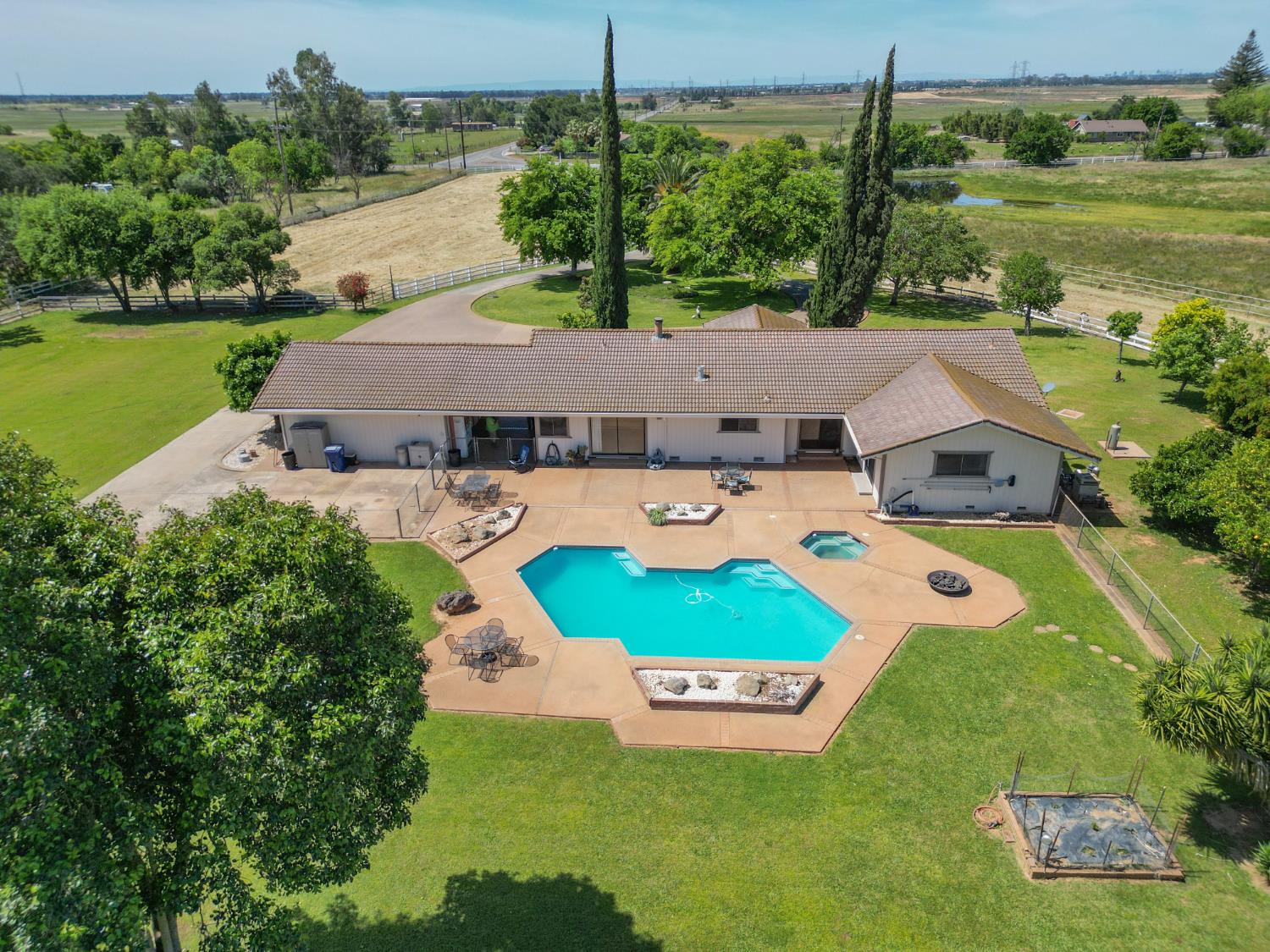 6323 Excelsior Road Sacramento, CA 95830 - Photo 11 of 75 an aerial view of a house with outdoor space swimming pool patio and lake view