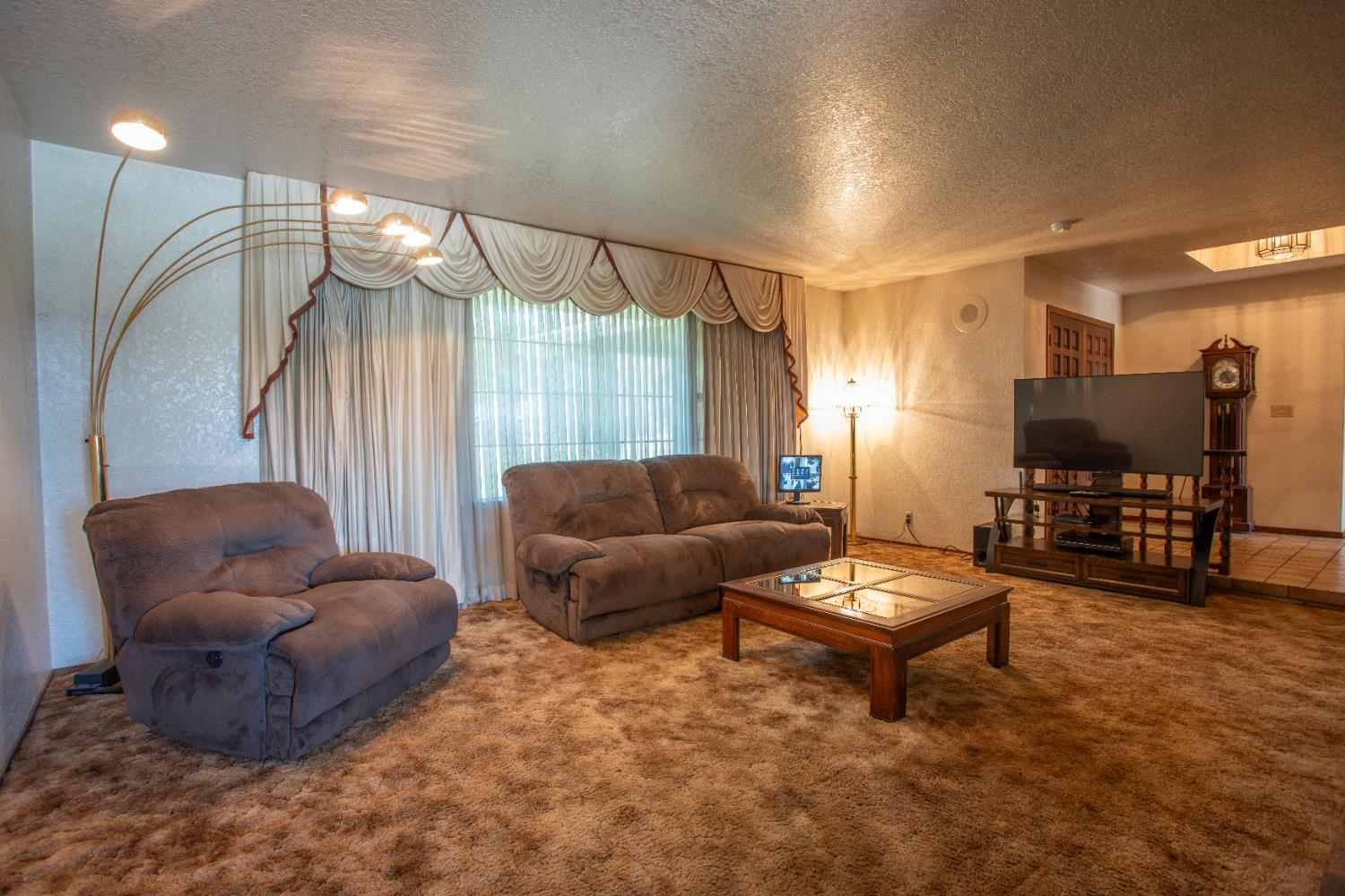 6323 Excelsior Road Sacramento, CA 95830 - Photo 13 of 75 a living room with furniture and a flat screen tv