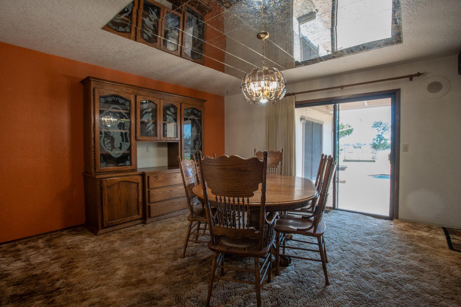6323 Excelsior Road Sacramento, CA 95830 - Photo 16 of 75 a view of a dining room with furniture window and wooden floor