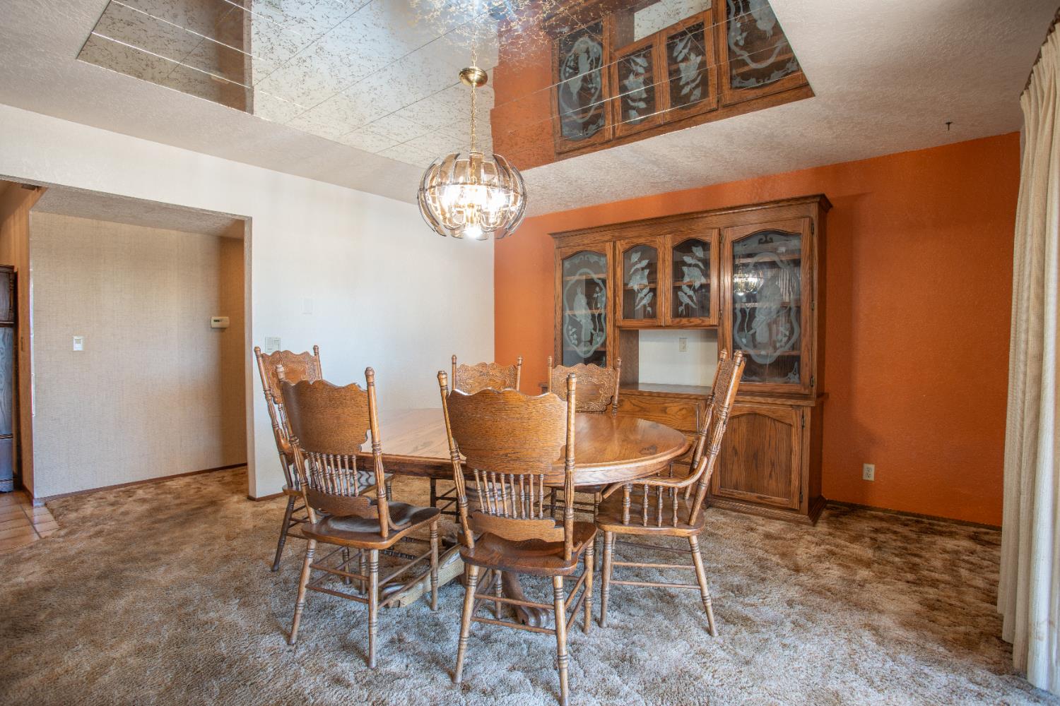 6323 Excelsior Road Sacramento, CA 95830 - Photo 17 of 75 a dining room with furniture a chandelier and wooden floor