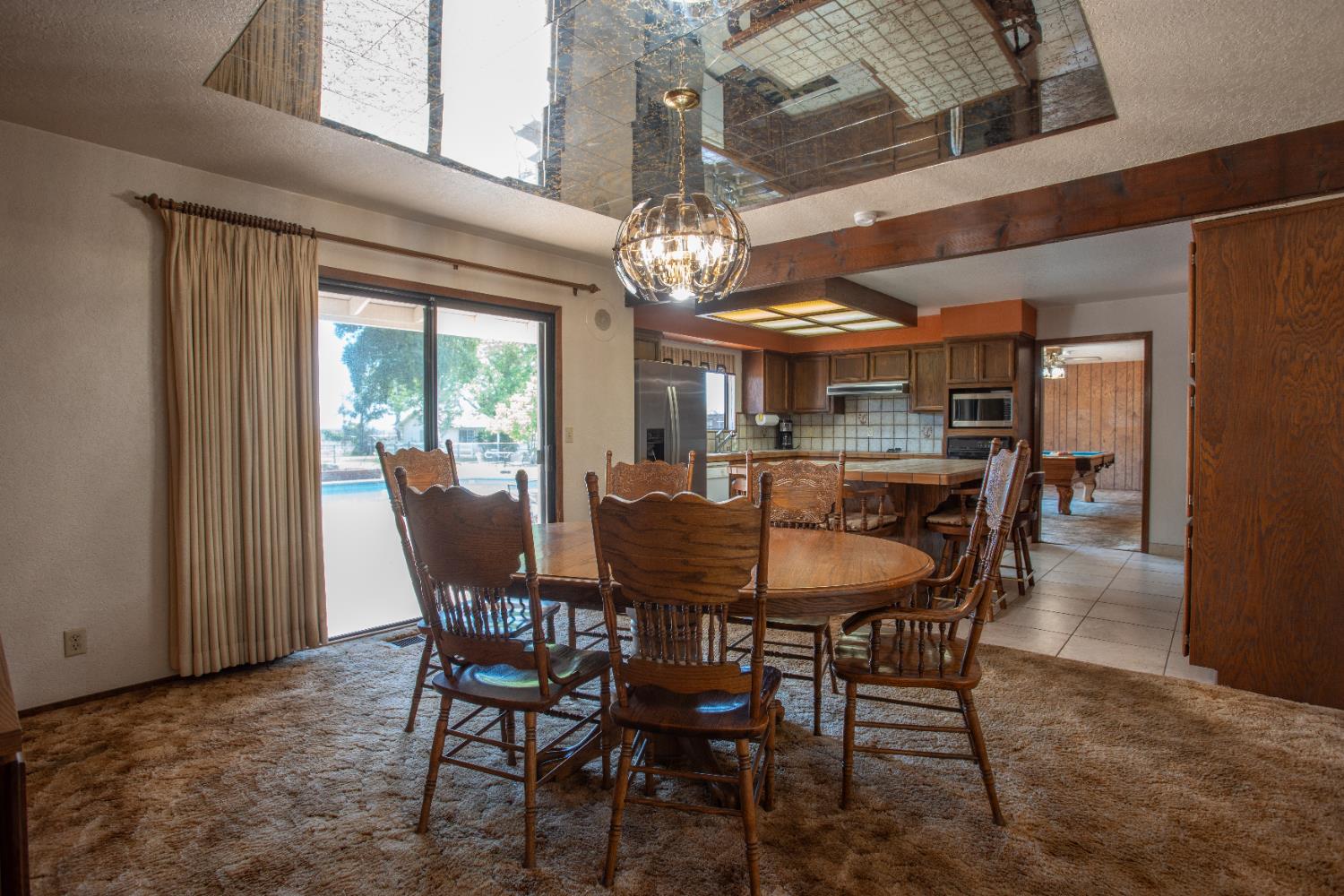 6323 Excelsior Road Sacramento, CA 95830 - Photo 18 of 75 a view of a dining room with furniture window and outside view