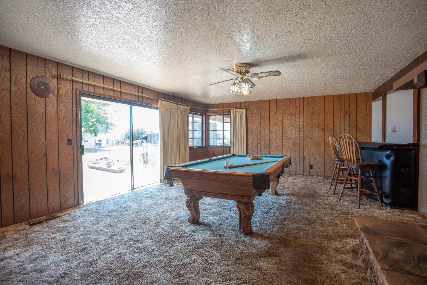 6323 Excelsior Road Sacramento, CA 95830 - Photo 23 of 75 a room with furniture pool table and a large window