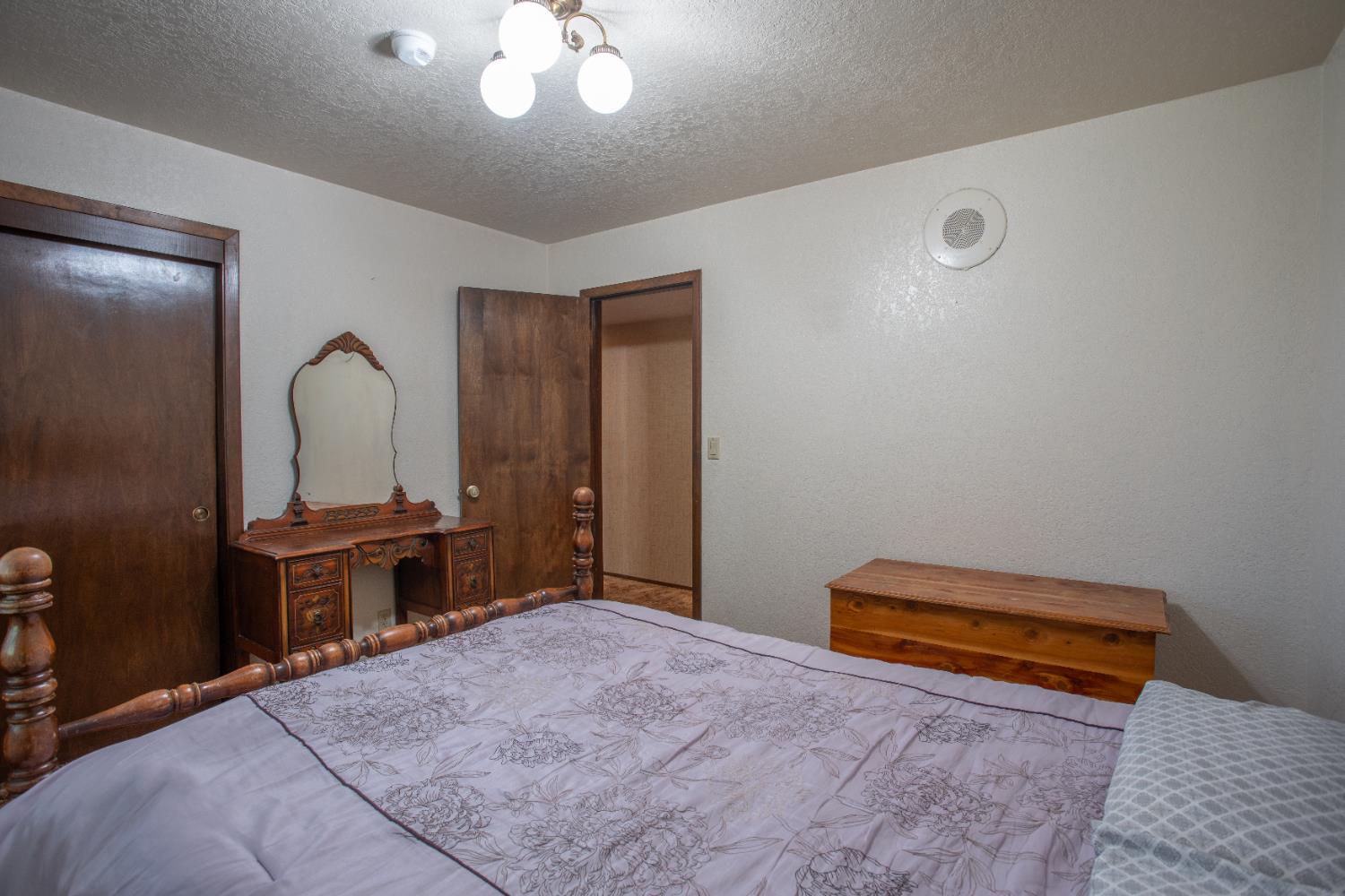 6323 Excelsior Road Sacramento, CA 95830 - Photo 29 of 75 a bedroom with a bed and a dresser